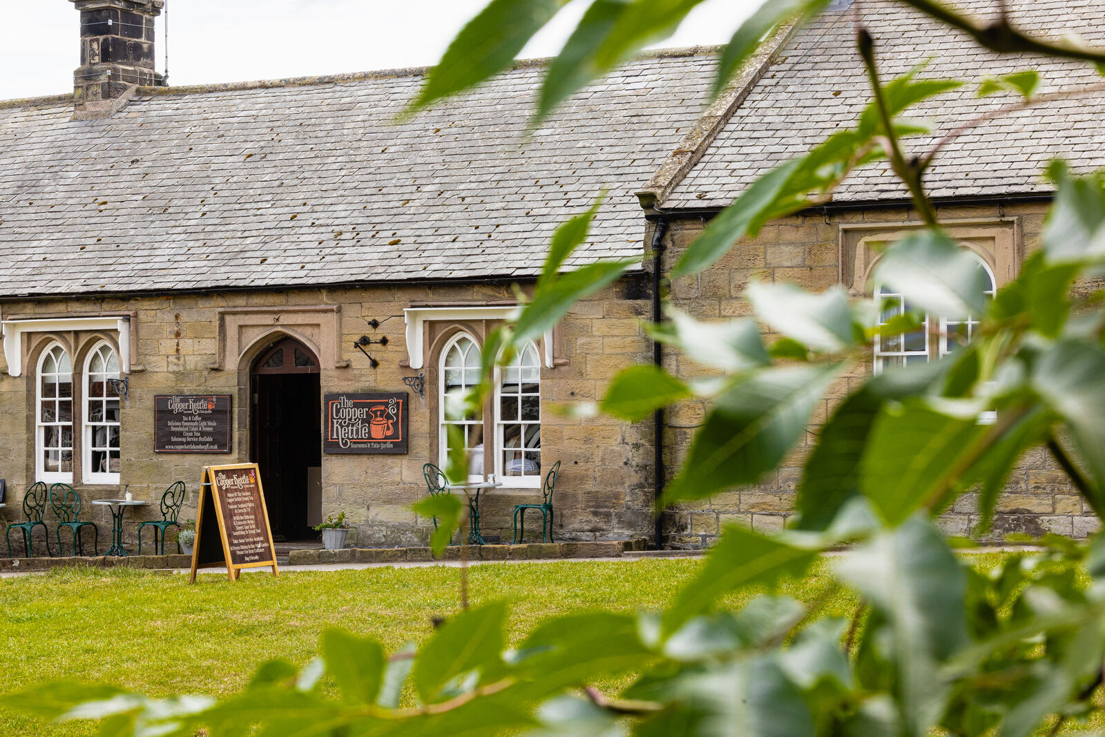 The Copper Kettle tearoom seen across the garden