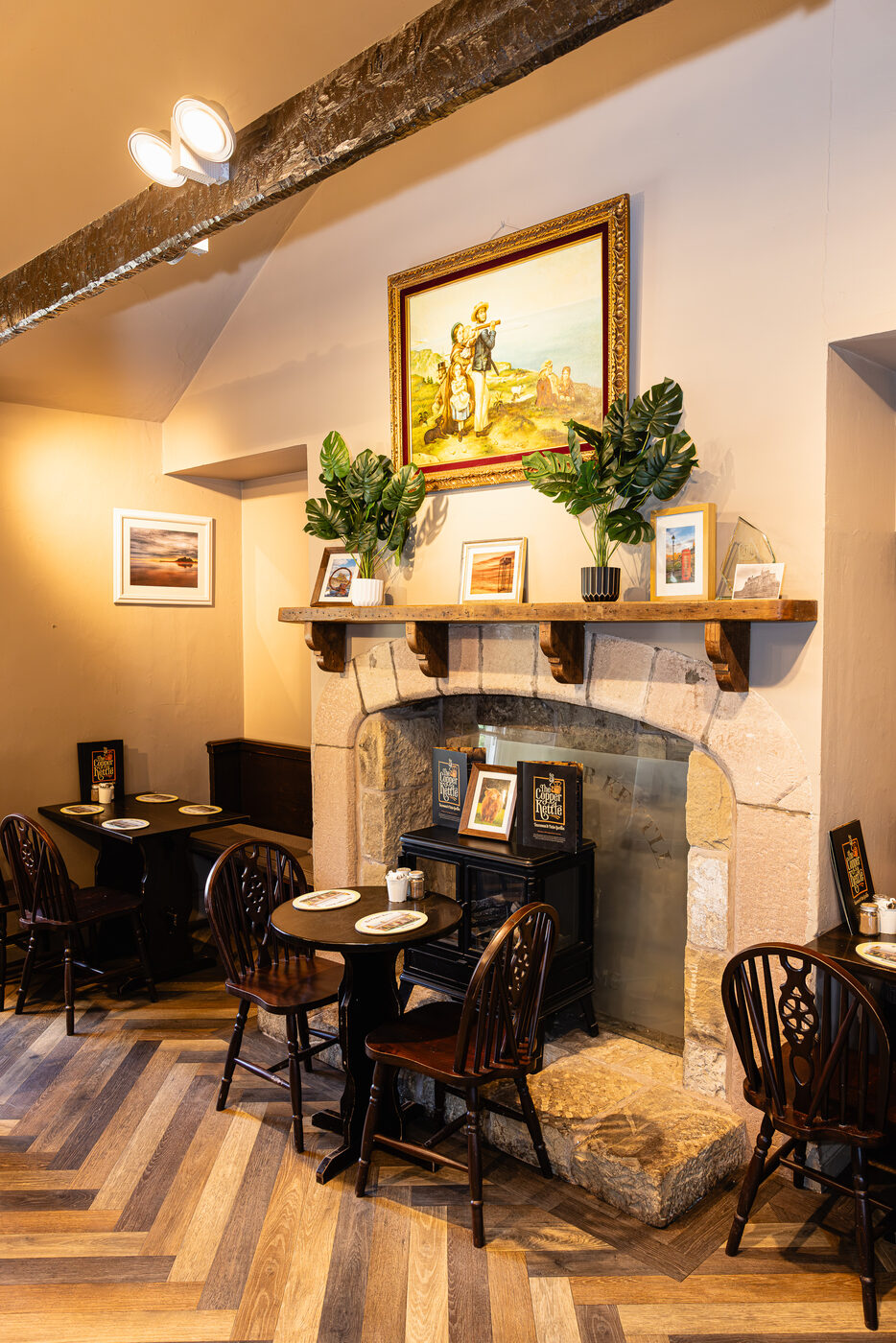 Cosy tearoom seating beside the original stone fireplace