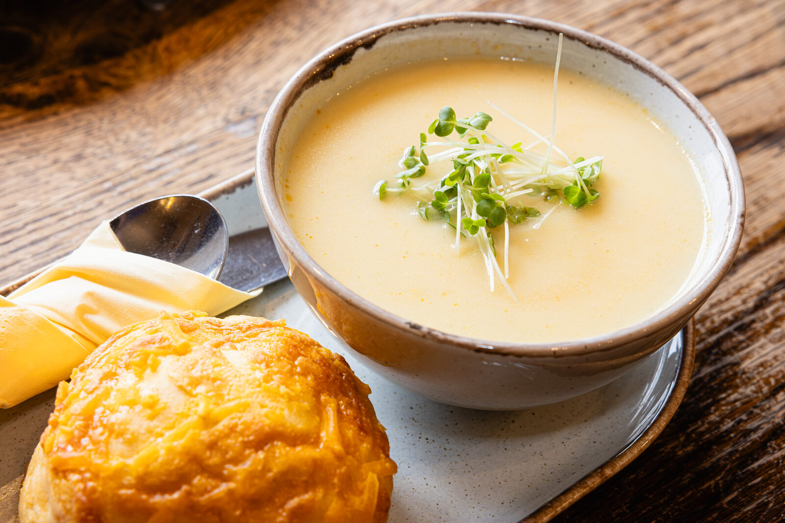 Homemade soup of the day with a warm cheese scone
